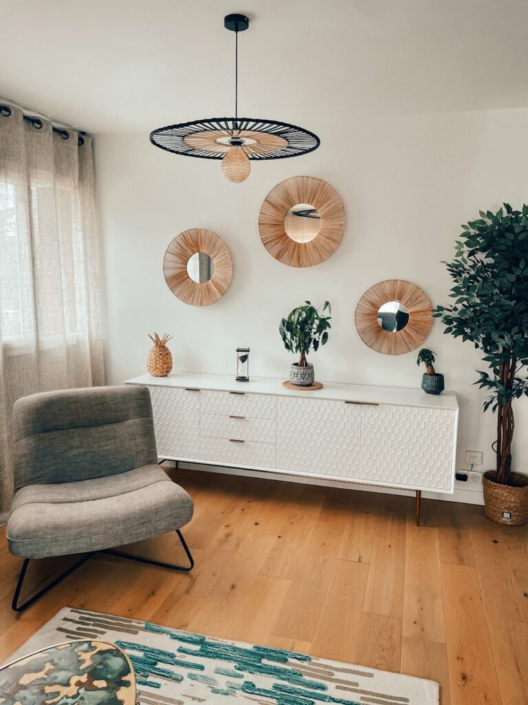 a room with a white table and chairs and a chandelier